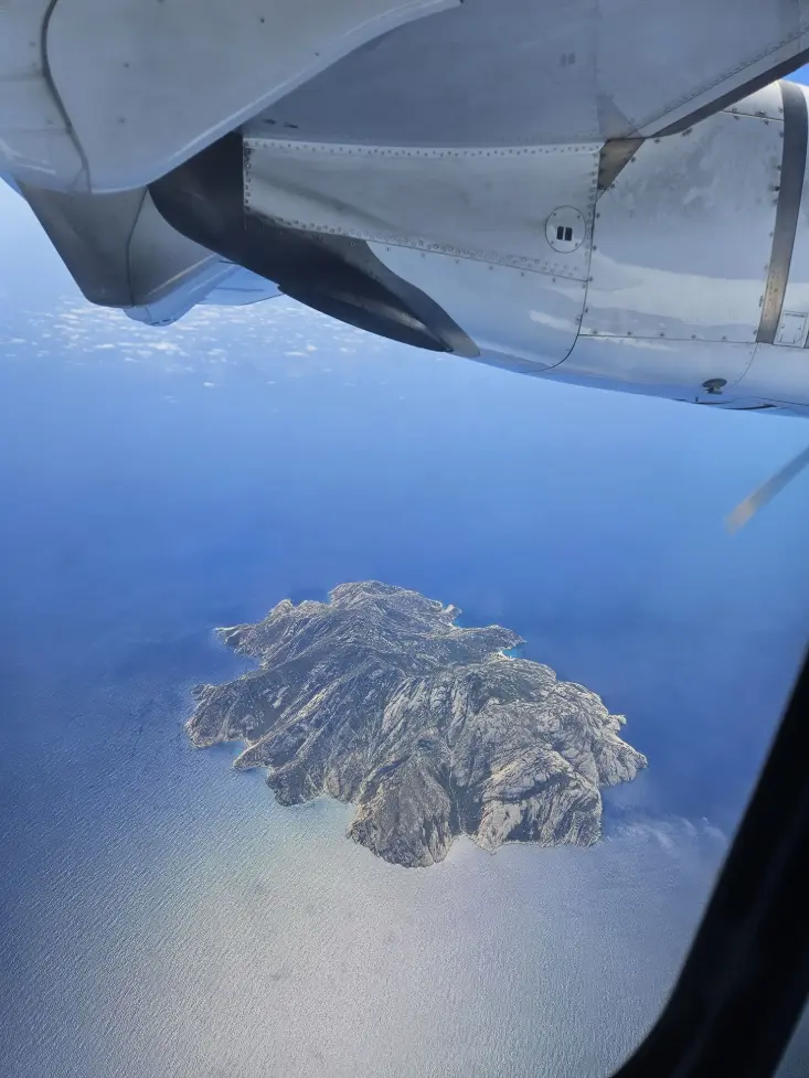 Flying over the Mediterranean sea to reach Corsica Island from Italy